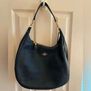 Coach navy blue hobo with cross body strap.